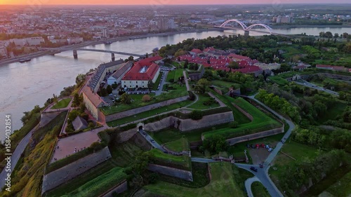 Explore Novi Sads majestic Petrovaradin fortress and scenic river views at sunset