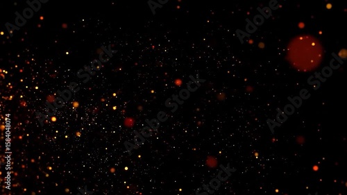 Glowing orange particles scattered on a dark backdrop