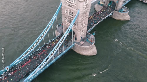 Runners crossing Tower Bridge with London.