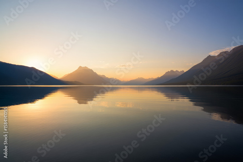 Wallpaper Mural Tranquil lake landscape at dawn or dusk, reflecting the majestic sky and mountains Torontodigital.ca