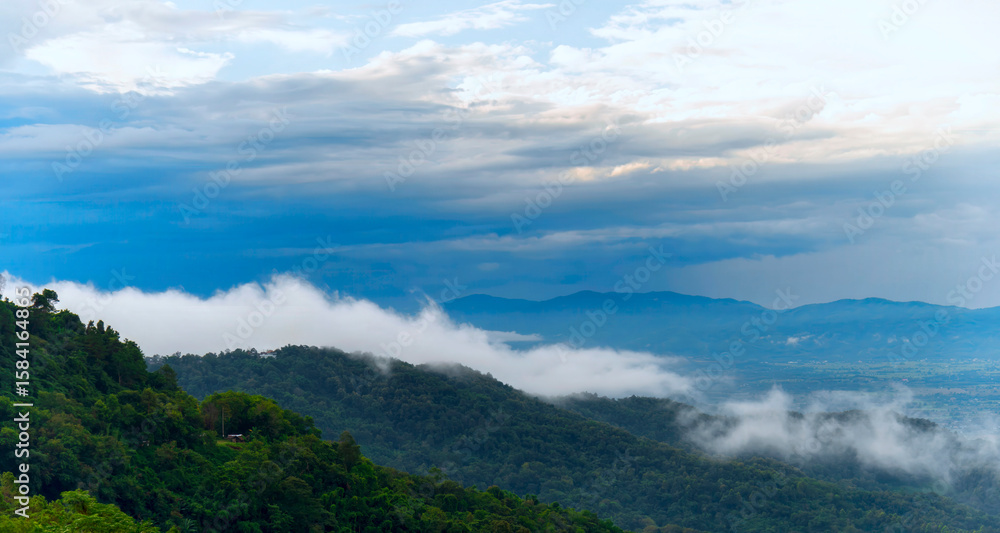 Fototapeta premium Beautiful Mountain landscape foggy windy mountain range green landscape asian farm. Amazing Landscape mountain green field meadow white cloud blue sky on sunrise. Countryside sunlight heaven scenery