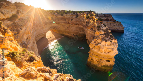 Coastal Sunset Landscape with Golden Rocks and Clear Ocean Water