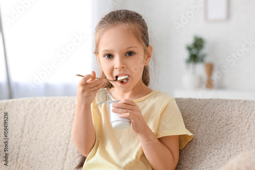 Cute little girl with spoon...