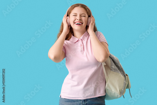 Happy female student with b...