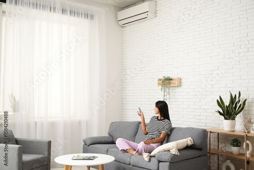 Young woman with air condit...