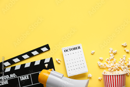 Calendar with movie clapper...