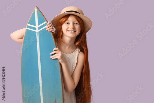Happy girl with surfboard o...