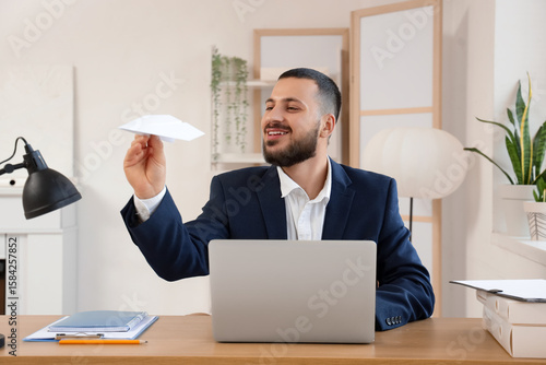Young businessman with pape...