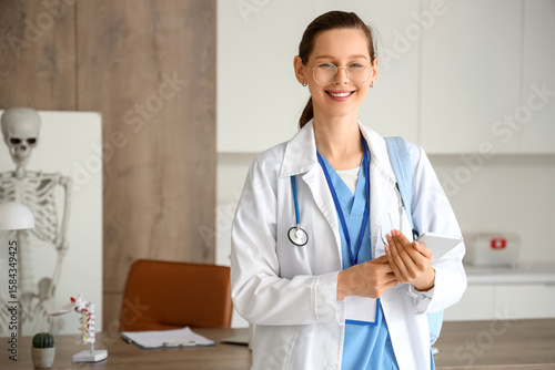 Healthcare professional and medical consultation, smiling young doctor with t...