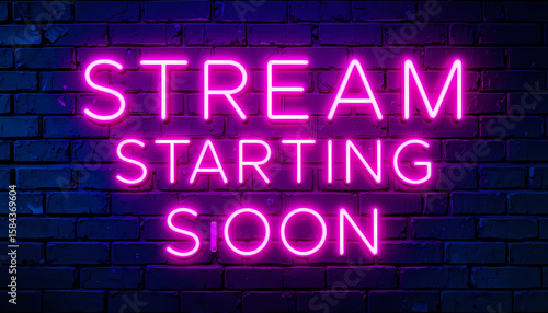 A neon sign on a brick wall that says stream starting soon in bright pink glowing letters on a dark background