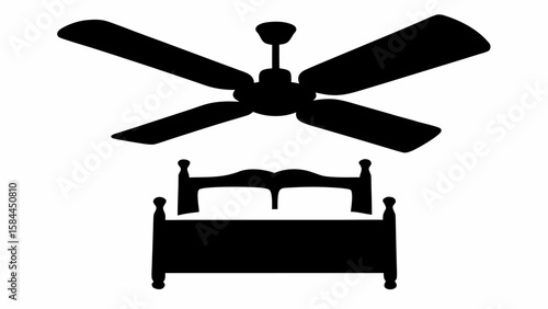 Silhouette of a four bladed ceiling fan above a bed with pillows and a headboard design in black