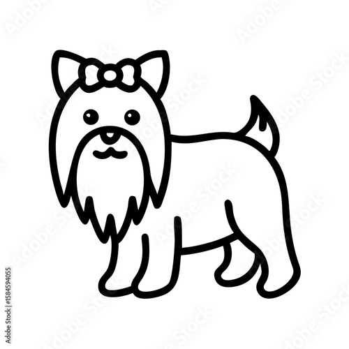 Groomed Yorkshire Terrier standing with a bow on its head  