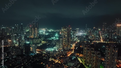 A hyperlapse aerial shot of Mumbai city at night, showcasing the dynamic cityscape illuminated with vibrant lights. Perfect for themes of finance, technology, infrastructure, metropolitan lifestyle.