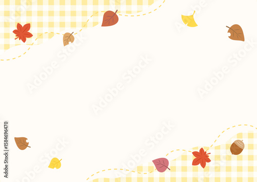 秋の紅葉した葉とギンガムチェックのフレーム、黄色のチェック柄