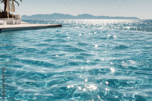 crystal clear water in pool reflects suns rays creating serene and captivating atmosphere