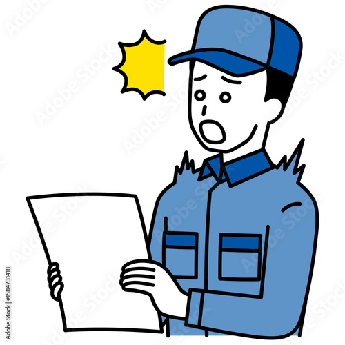 書類を見て驚くつなぎ作業服の男性
