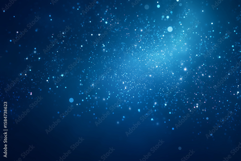 Fototapeta premium Sparkling blue particles drift across dark background