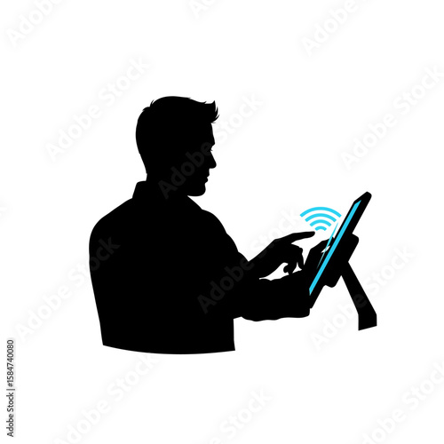 Silhouette of a man using a tablet computer with wireless connection.