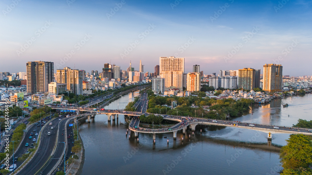 Fototapeta premium Panoramic view of Saigon, Vietnam from above at Ho Chi Minh City's central business district. Cityscape and many buildings, local houses, rivers. Landscape concept.