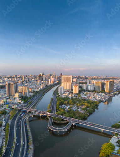 Panoramic view of Saigon, Vietnam from above at Ho Chi Minh City's central business district. Cityscape and many buildings, local houses, rivers. Landscape concept.