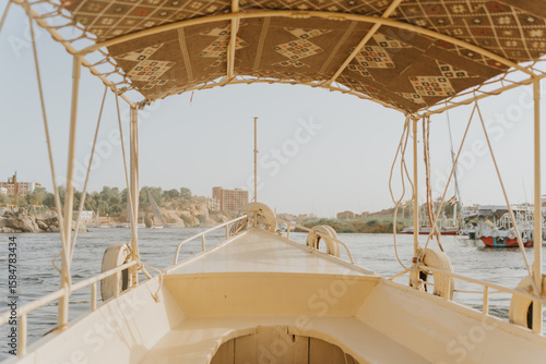 Fotografie Felucca sailing on the nile river near aswan, egypt