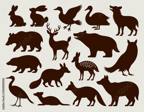 Silhouette illustration featuring a collection of various wild animals, including mammals and birds, in a dark brown color against a light background.