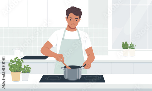 A man in an apron stirs food in a pot on a stove in a bright, modern kitchen setting.