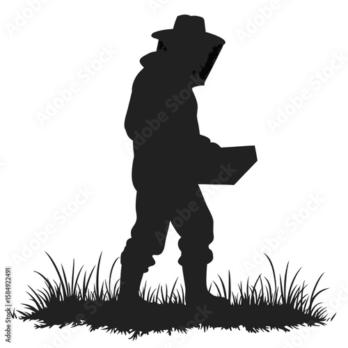 Beekeeper in protective suit walking through grass holding equipment beekeeping veil
