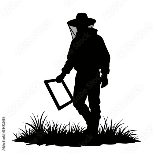 Beekeeper silhouette holding frame in grassy field veil