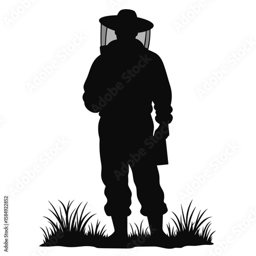 Beekeeper silhouette wearing protective suit and hat standing in grass veil