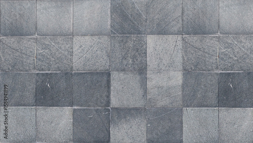 Textured gray slate tiles with a subtle linear pattern, creating a sophisticated and modern surface
