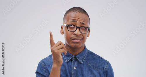 Wall Mural Confused, black man and thinking with solution in studio for conclusion, problem solving and aha