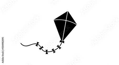 A monochrome kite soaring against the sky, representing freedom and joy.