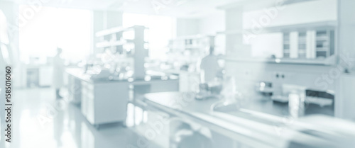 Extremely blurred interior of a clinical laboratory or clean room setting, with bright white tones and indistinct shapes, ideal as a sterile background or abstract backdrop.