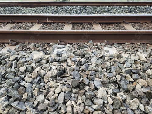 Photos A pile of ballast stones on a railroad pad