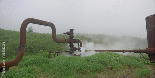 Steam leak jet blows from Rusty pipes