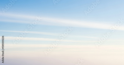Fototapeta Naklejka Na Ścianę i Meble -  Soft pastel colors merging into a gentle gradient sky, with faint cloud formations adding subtle depth, making it perfect for abstract backgrounds or minimalist visuals.