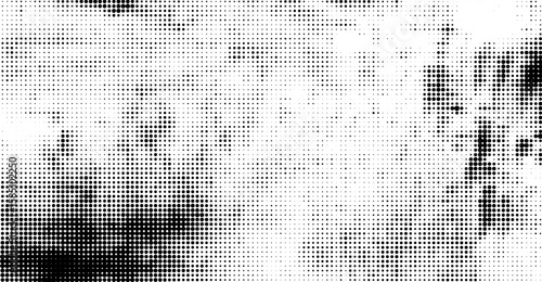 A unique halftone pattern in black and white reveals a textured, gradient background with varied dot densities, forming diffused organic shapes that suggest a modern, abstract effect
