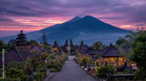 Dramatic dawn view of Pura Besakih temple complex nestled on the slopes beneath Mount Agung volcano.
