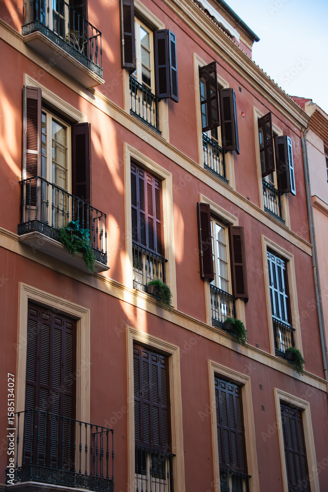 Naklejka premium Classic Elegance: Traditional Spanish Windows in Malaga
