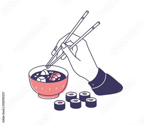 Japanese food eating. Hand with chopsticks, miso soup served in bowl, maki su...
