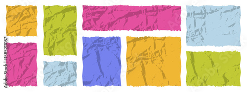 Colorful crumpled paper in various shades arranged in a playful pattern on a white background