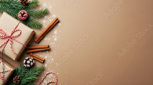 Festive christmas gifts with pine branches cinnamon sticks snowflakes and peppermint candies on a warm brown background