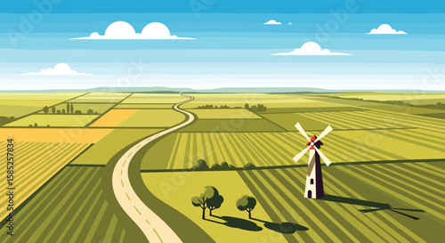 Idyllic rural landscape with a traditional dutch windmill and winding country road