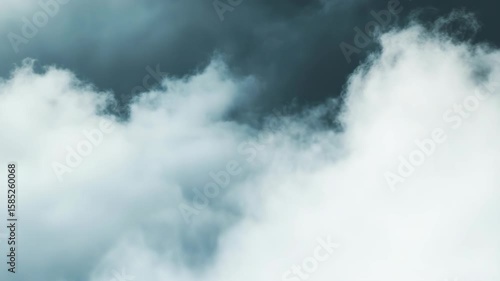 A cloudless sky with a few clouds. The clouds are white and fluffy. The sky is blue