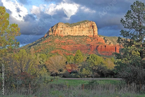 Red rock mesa at sunset.  Dramatic clouds
