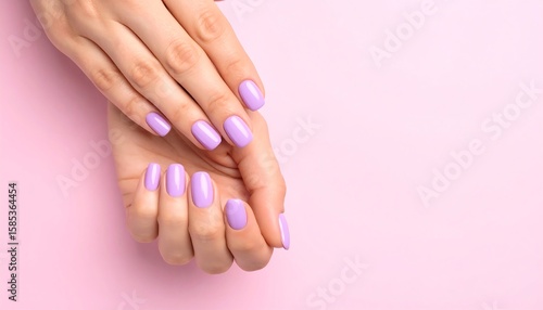 Close-up of manicured hands.  Soft lilac nails