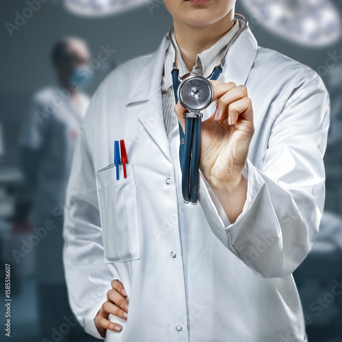 Close-up of doctor in white medical coat with stethoscope, cropped professional figure representing medicine, health care, regular check-ups, prevention and medical diagnostics concept.