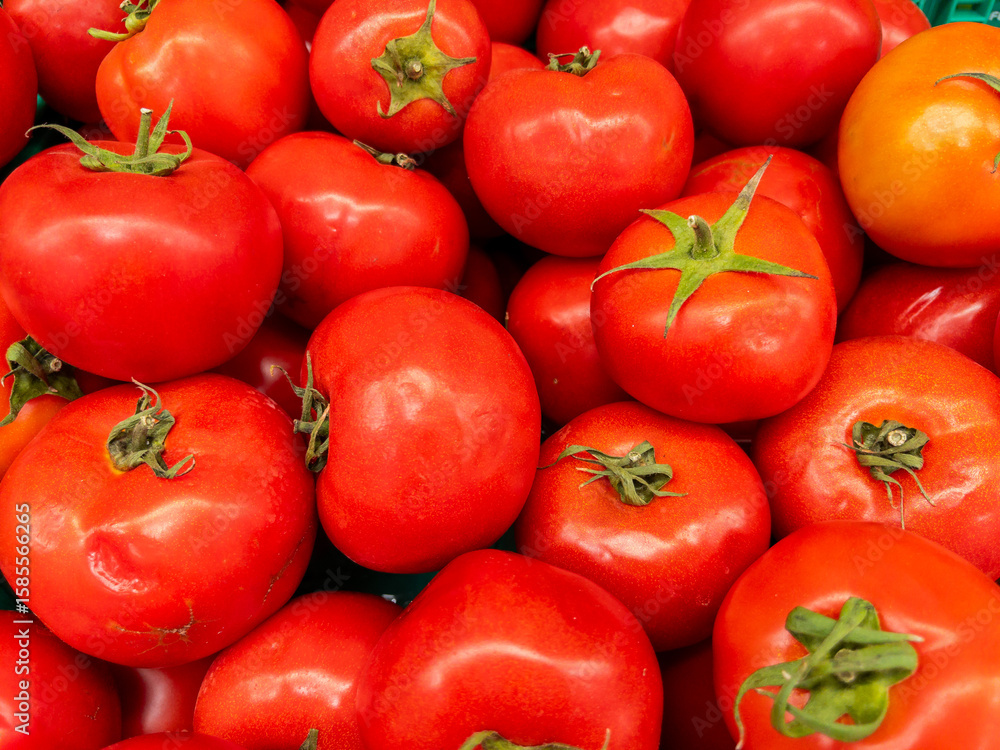 Fresh tomatoes on the market stall, closeup Fresh tomatoes on the market stall, closeup