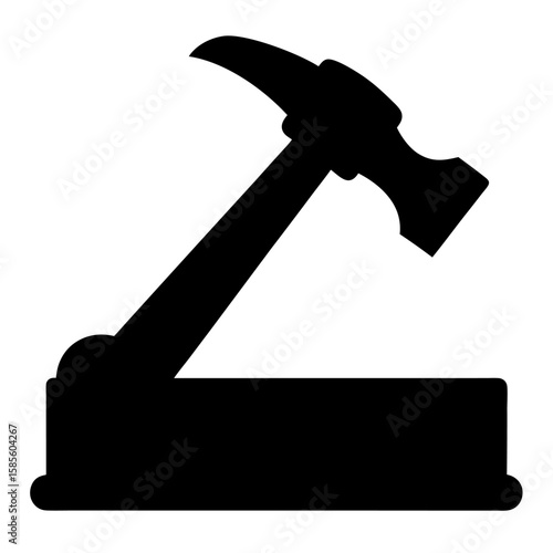 Black silhouette of a hammer resting on a wooden plank isolated on white background